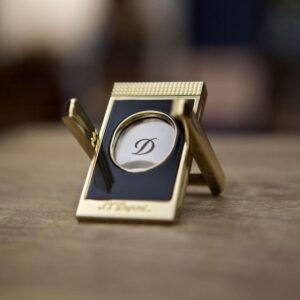 S.T. Dupont folding cigar X stand in black lacquer with gold trim holding a cigar